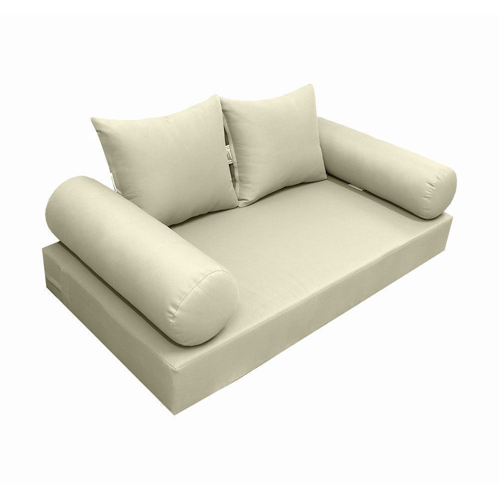 Elegant cushion and bolster set featuring refined craftsmanship and knife-edge detailing, designed for versatile indoor and outdoor comfort.