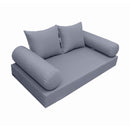 Elegant cushion and bolster set featuring refined craftsmanship and knife-edge detailing, designed for versatile indoor and outdoor comfort.