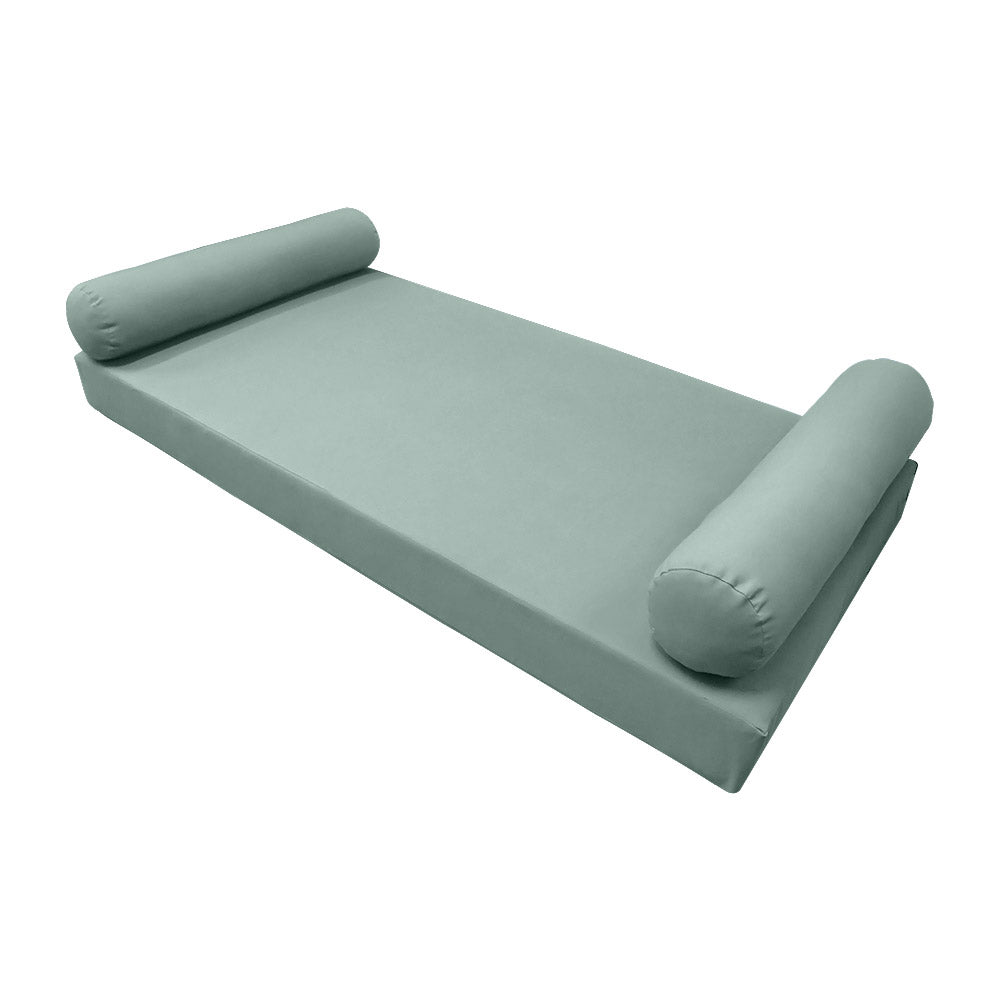 Elegant cushion and bolster set featuring refined craftsmanship and knife-edge detailing, designed for versatile indoor and outdoor comfort.