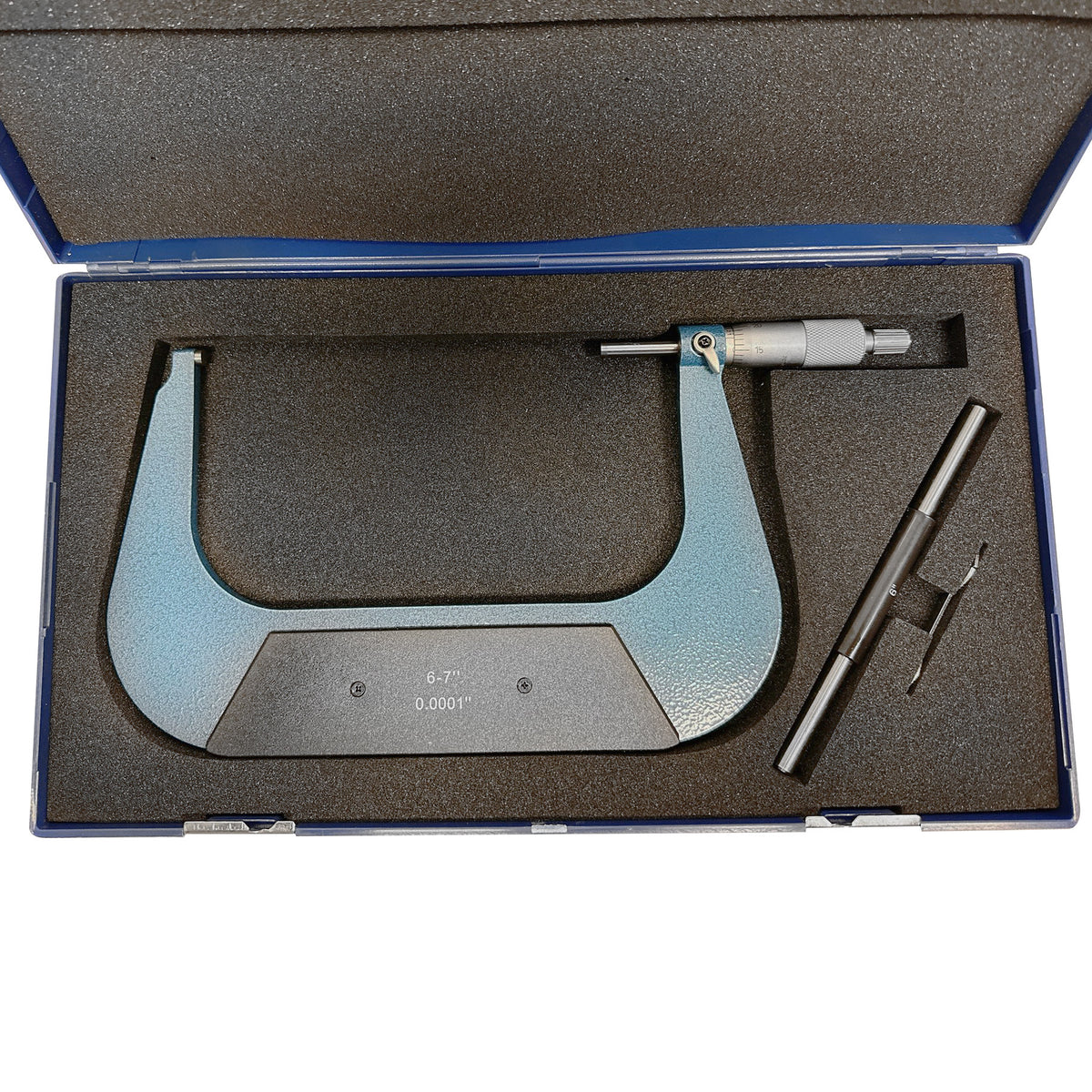 6-7 inch machinist micrometer set with calibration rod and wrench in foam-lined box.