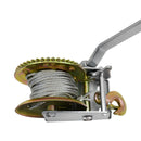 Close-up of manual hand crank winch with steel cable and gear mechanism