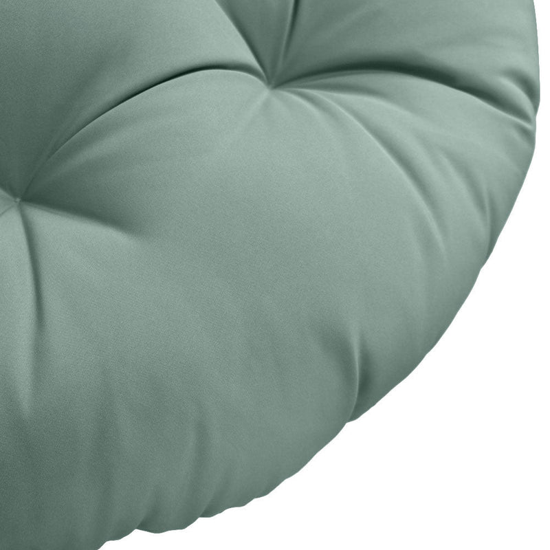 Close-up of papasan cushion fabric and tufted stitching detail.