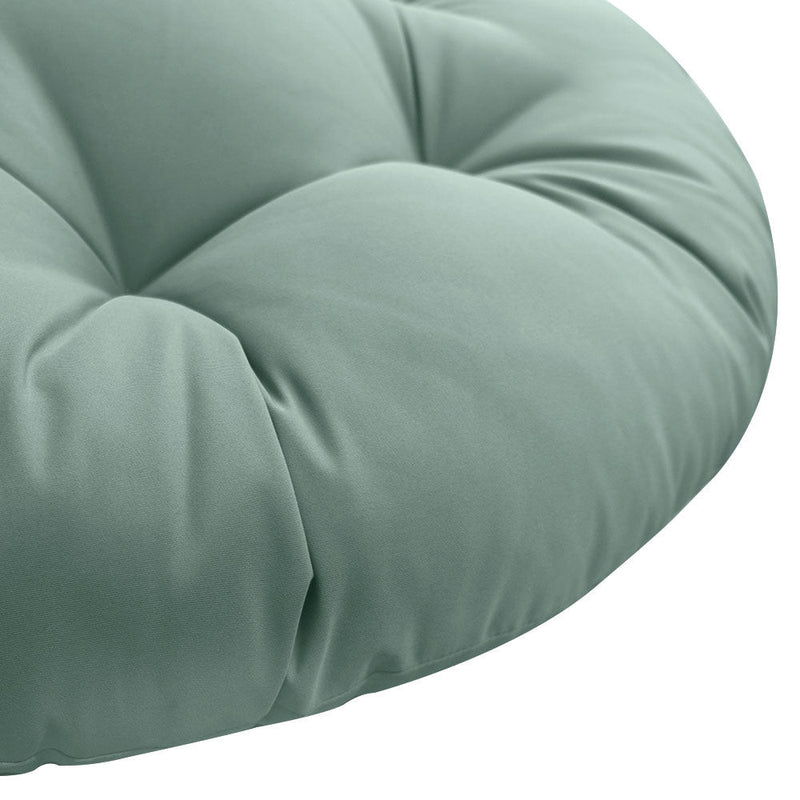 Close-up of papasan cushion fabric and tufted stitching detail.