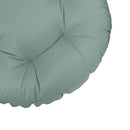 Close-up of papasan cushion fabric and tufted stitching detail.