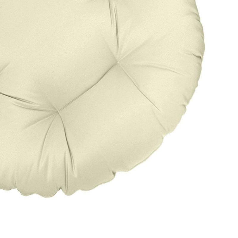 Close-up of papasan cushion fabric and tufted stitching detail