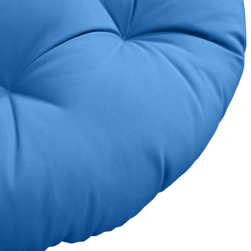 Close-up of papasan cushion fabric and tufted stitching detail.