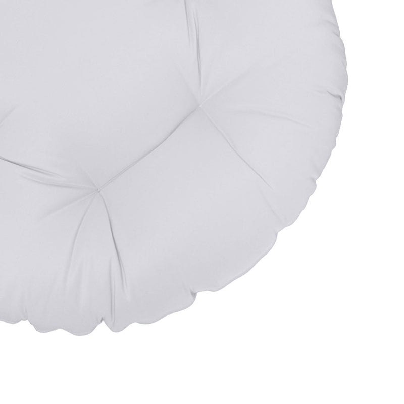 Close-up of papasan cushion fabric and tufted stitching detail.