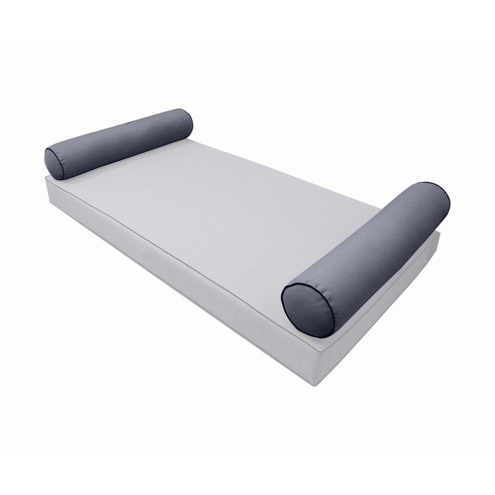 Elegant cushion and bolster set featuring refined craftsmanship and knife-edge detailing, designed for versatile indoor and outdoor comfort.