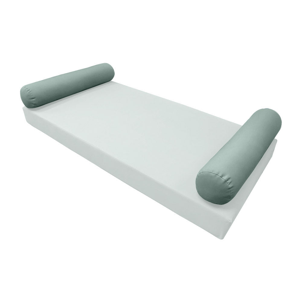 Elegant cushion and bolster set featuring refined craftsmanship and knife-edge detailing, designed for versatile indoor and outdoor comfort.