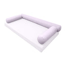 Elegant cushion and bolster set featuring refined craftsmanship and knife-edge detailing, designed for versatile indoor and outdoor comfort.