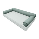 Elegant cushion and bolster set featuring refined craftsmanship and knife-edge detailing, designed for versatile indoor and outdoor comfort.