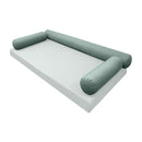 Elegant cushion and bolster set featuring refined craftsmanship and knife-edge detailing, designed for versatile indoor and outdoor comfort.