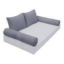 Elegant cushion and bolster set featuring refined craftsmanship and knife-edge detailing, designed for versatile indoor and outdoor comfort.
