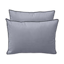 Pillow and bolster cushions displayed on an outdoor porch swing for a cozy, elegant setting.