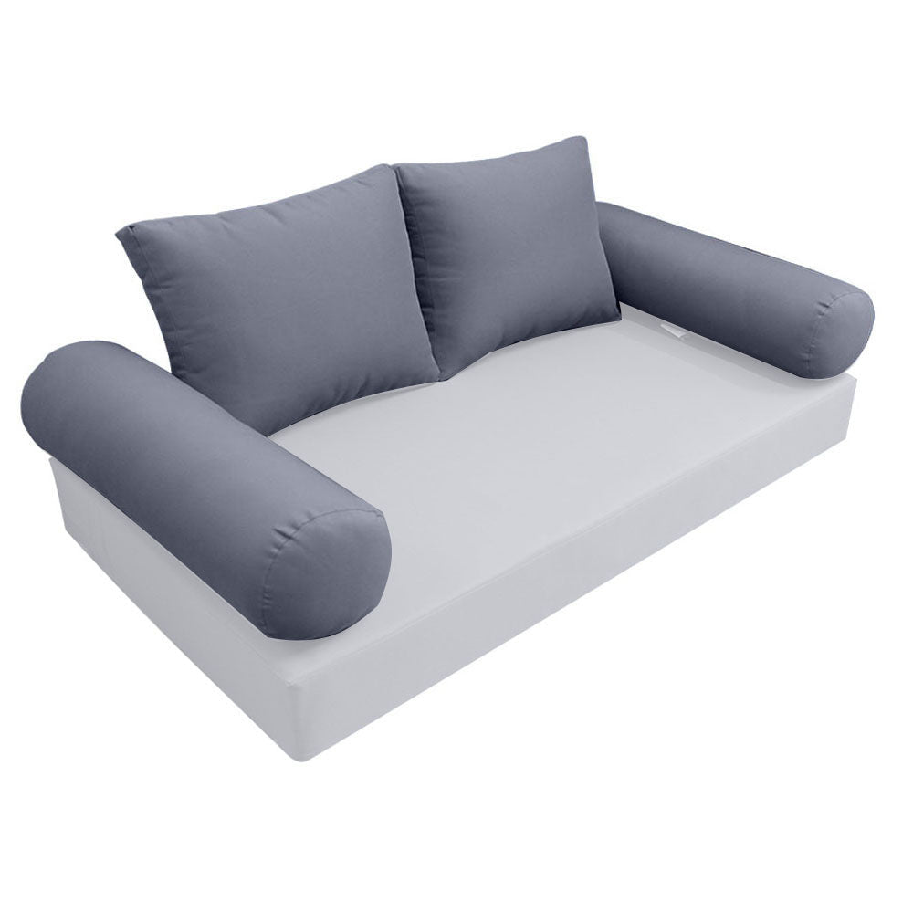 Elegant cushion and bolster set featuring refined craftsmanship and knife-edge detailing, designed for versatile indoor and outdoor comfort