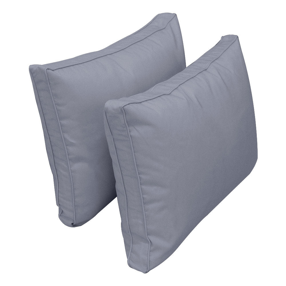 Pillow and bolster cushions displayed on an outdoor porch swing for a cozy, elegant setting.

