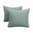 Pillow and bolster cushions displayed on an outdoor porch swing for a cozy, elegant setting.