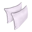 Pillow and bolster cushions displayed on an outdoor porch swing for a cozy, elegant setting.