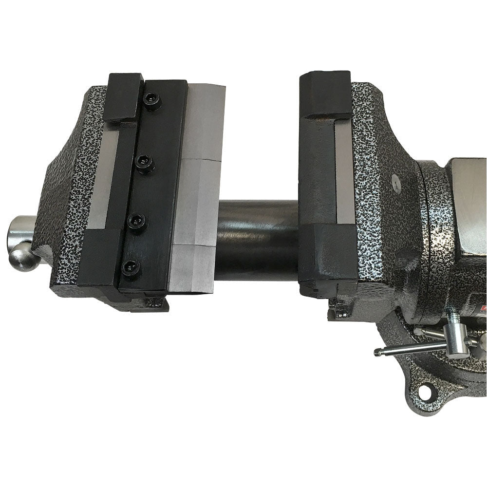 Sheet metal bending press brake attachment clamped to industrial bench vise.